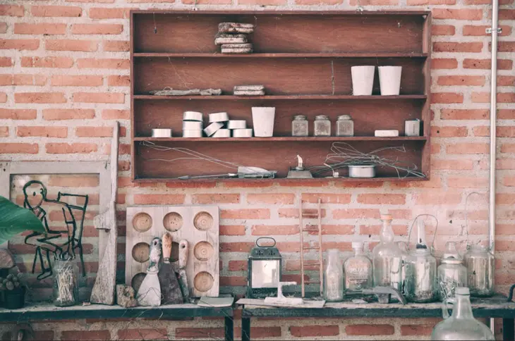 A close-up of a Japanese woodworker using traditional hand tools to craft a wooden joint, exemplifying the meticulous techniques and attention to detail in Japanese woodworking.